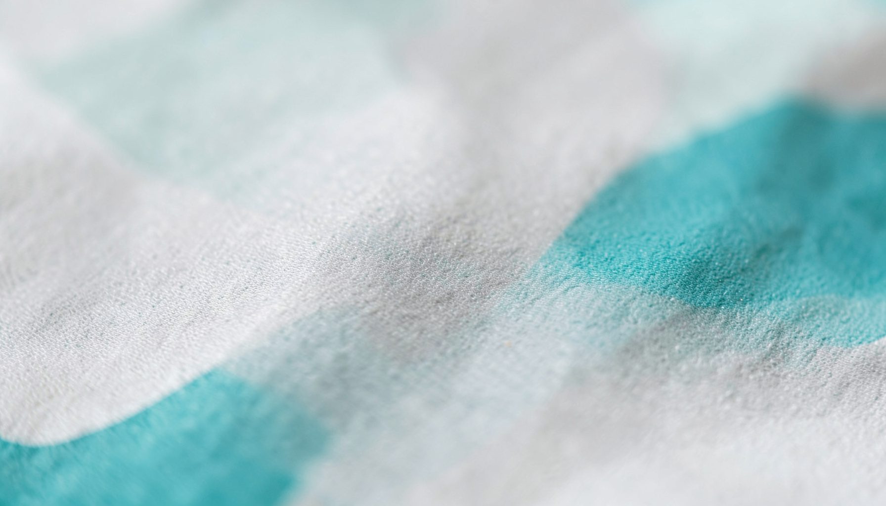 A wide, light-toned abstract banner with soft neutral grays and subtle teal highlights, conveying a calm and professional atmosphere